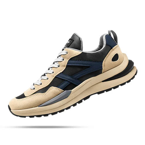 O Tênis Masculino Romenzi RZ383 está disponível em bege e cinza, com acabamento em couro e camurça, palmilha em látex e sola antiderrapante segura.